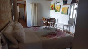 Postel nebo postele na pokoji v ubytování Villino Tronchetto Bianco