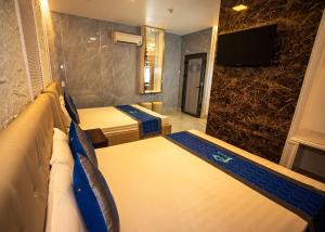 Postel nebo postele na pokoji v ubytování Phuc Hotel