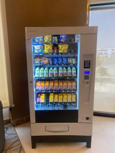 a vending machine filled with drinks and soda at درر بيان in Hafr Al-Batin