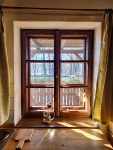 a window in a room with a wooden door at Apartmány Červený Dvůr in Chvalšiny