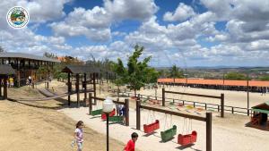 two children playing in a playground at a park at Gravatá - Apartamento Família no Monte Castelo in Gravatá +12 photos