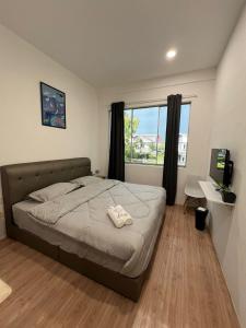 Postel nebo postele na pokoji v ubytování KIWI INN