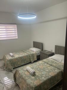 Postel nebo postele na pokoji v ubytování Maisonette 2