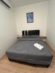 Postel nebo postele na pokoji v ubytování KIWI INN