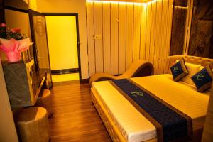 Postel nebo postele na pokoji v ubytování Phuc Hotel