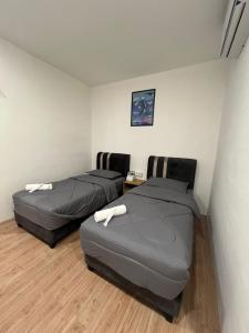Postel nebo postele na pokoji v ubytování KIWI INN