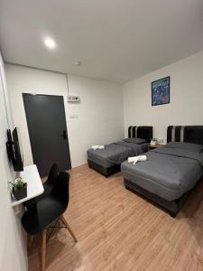Postel nebo postele na pokoji v ubytování KIWI INN