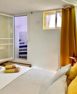 A bed or beds in a room at Holidays in Tarajalejo - home office with sea view