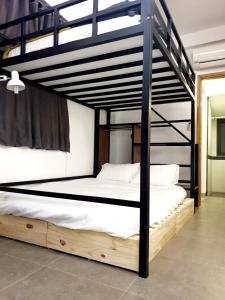 a couple of bunk beds in a room at ZVillage NCC - Modern Townhouse in District 1 in Ho Chi Minh City