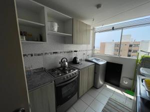 Кухня или кухненски бокс в Lindo y Acogedor Departamento en Lima!