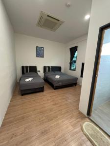 Postel nebo postele na pokoji v ubytování KIWI INN