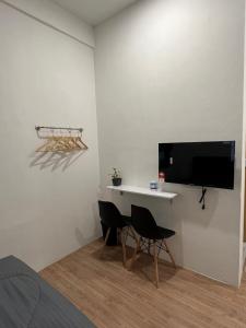 TV a/nebo společenská místnost v ubytování KIWI INN