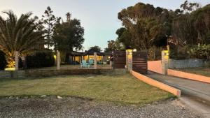 a person standing in the yard of a house at Las Ranitas in Parque del Plata