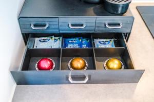 a drawer with three boxes of eggs in it at Sterling Suite - Modern 2 Bedroom Apartment in Birmingham City Centre - Perfect for Family, Business and Leisure Stays by Dreamluxe in Birmingham