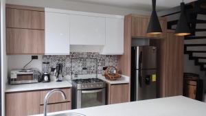 Kuchyň nebo kuchyňský kout v ubytování Pent House Exclusivo