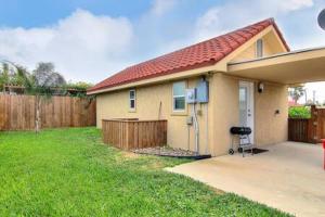 a small house with a fence and a yard at Spanish Village Siesta Villa in Port Aransas