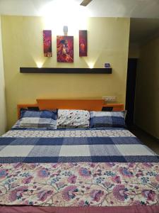 a bedroom with a large bed in a room at Joys Stay in Trichūr