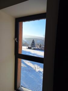 Nespecifikovaný výhled na hory nebo výhled na hory při pohledu z apartmánu