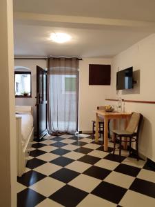 a hotel room with a checkered floor at Lamar in Cres +14 photos