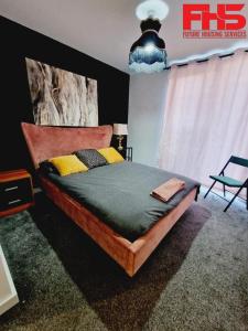 a bedroom with a large bed in a room at Digbeth Luxury Apartment in Birmingham