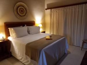 Cama ou camas em um quarto em Hiu Hotel