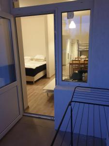 a view of a room with a bed and a mirror at The old school motell & lägenheter in Marma