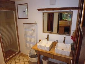 a bathroom with a sink and a shower at Augettes Bergerie in Saint-Hymer