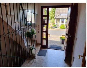 an entrance to a house with a wrought iron gate at Messezimmer in Edemissen