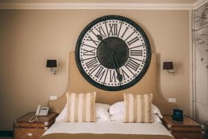 Voodi või voodid majutusasutuse La Dépendance Hotel toas