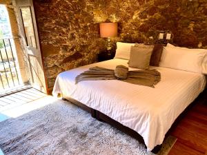 Postel nebo postele na pokoji v ubytování HOTEL MINA REAL