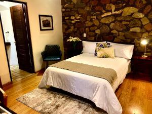 Postel nebo postele na pokoji v ubytování HOTEL MINA REAL