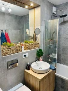 Et badeværelse på Komfortowy apartament Krokusowa 6