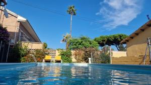 a swimming pool in front of a house at Pool and relax 20' from Barcelona in Premiá de Mar