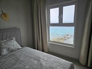 Кровать или кровати в номере Seaview Resort Boca Sami