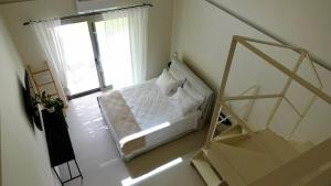 Postel nebo postele na pokoji v ubytování Pnoe Eco Residences