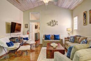 a living room filled with furniture and a tv at Crane's Landing at Pirates Bay in Port Aransas +27 photos