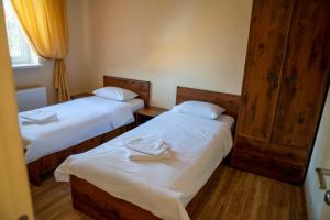 A bed or beds in a room at Guest house Kiev forest