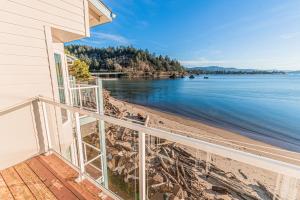 a balcony of a house with a view of the beach at Dock of The Bay #306 in Lincoln City