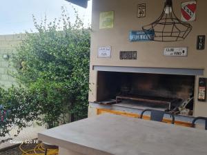a table in front of a pizza oven with a fireplace at Loft San Francisco, Cordoba in San Francisco