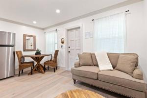 a living room with a couch and a table at Newly Renovated 1BR apartment in the heart of WPB in West Palm Beach