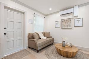 a living room with a couch and a table at Newly Renovated 1BR apartment in the heart of WPB in West Palm Beach