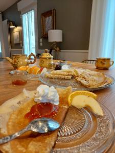a table with a plate of food on a table at "Ô Tour's Angels" A Côté in Tours