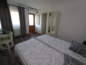 a bedroom with a large bed in a room at Pestele Ca Odinioară in Murighiol +60 photos
