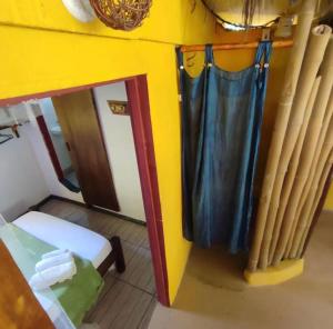 Giường trong phòng chung tại Casa Gêmeos