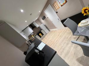 an overhead view of a kitchen with a table and chairs at Premier inn comfort mattresses - sleeps 6 in Middleton