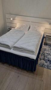 an unmade bed in a room with at Holiday apartment in Kleppstad