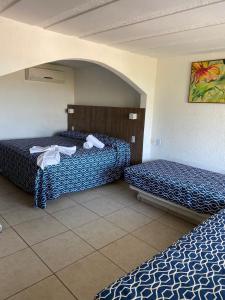 Postel nebo postele na pokoji v ubytování Hotel Torre Molino