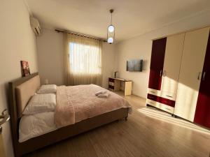 Postel nebo postele na pokoji v ubytování Elbasan center family apartment n.42