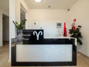 a counter in a store with a sign on it at Penzion ARIES in Nitra