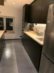 Kuchyň nebo kuchyňský kout v ubytování Froissart Loft et Studio
